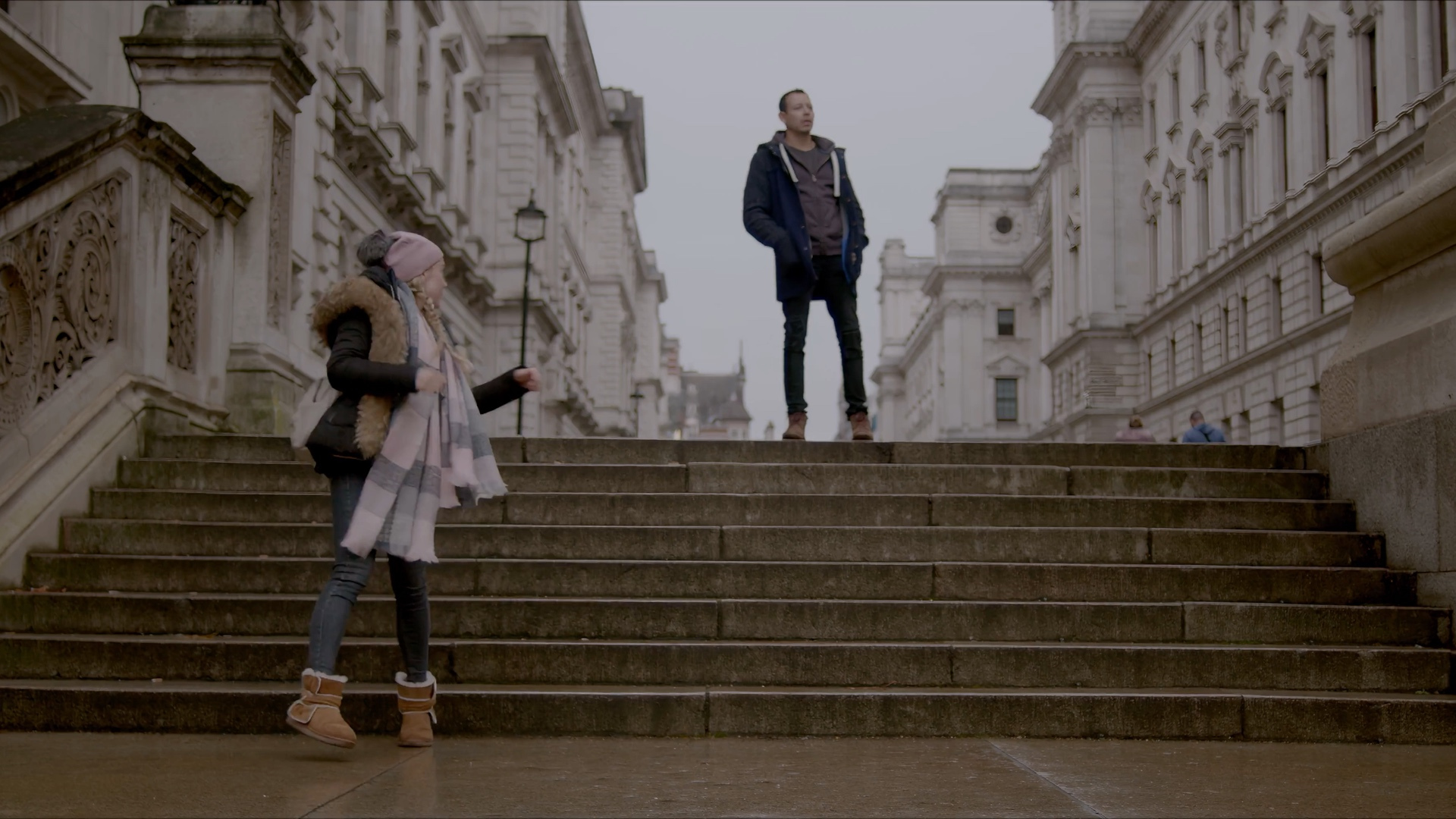 Kian and Hanna meeting on a London stairway
